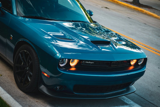 a blue car on a road