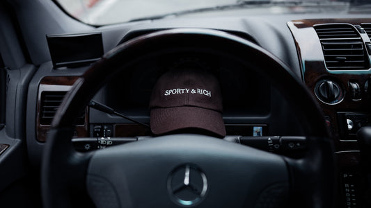 a car dashboard with a hat on top of it