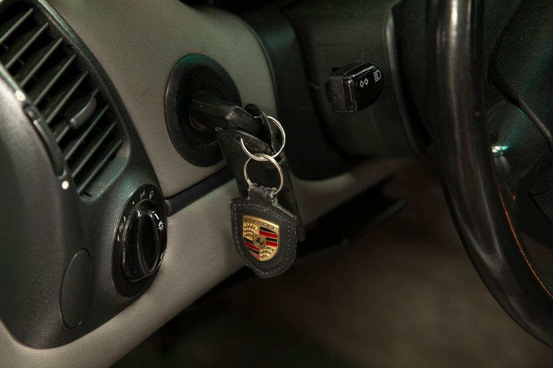 A car door handle with a car key on it