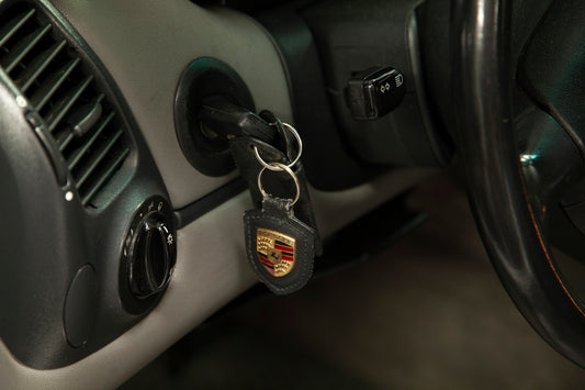 A car door handle with a car key on it