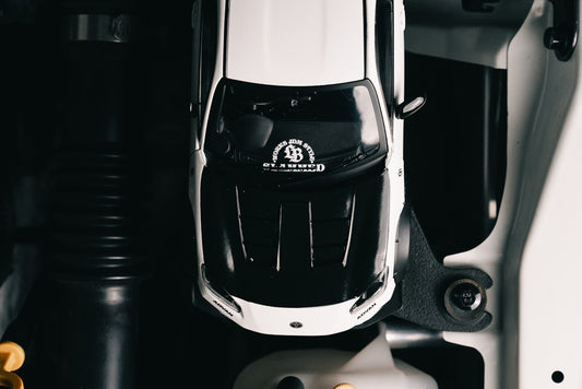 Top view of a white and black toy car