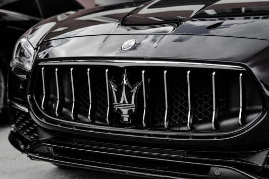 Close-up of a black maserati car grille